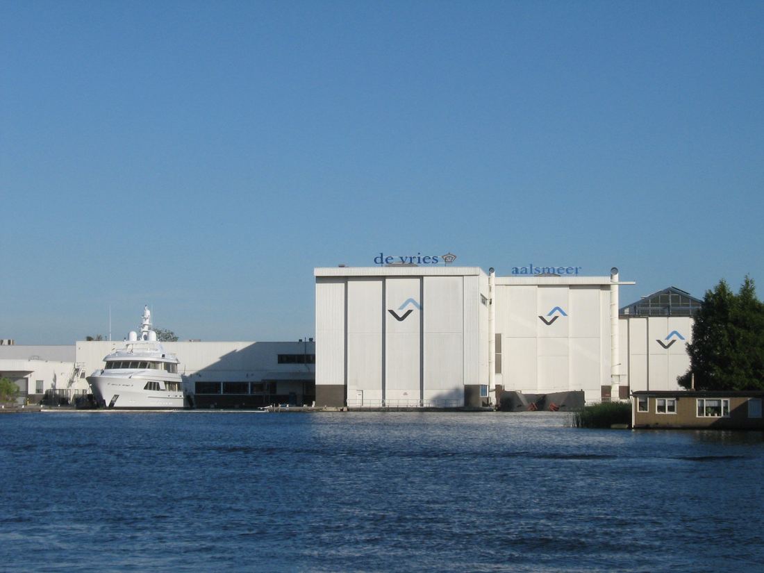 White yacht construction halls at Aalsmeer in the Netherlands seen across the water