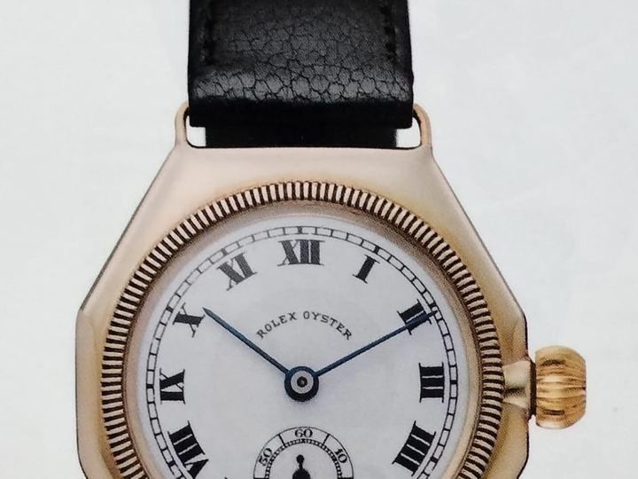 An early Rolex Oyster wristwatch from 1926 with an octagonal gold case and a white dial