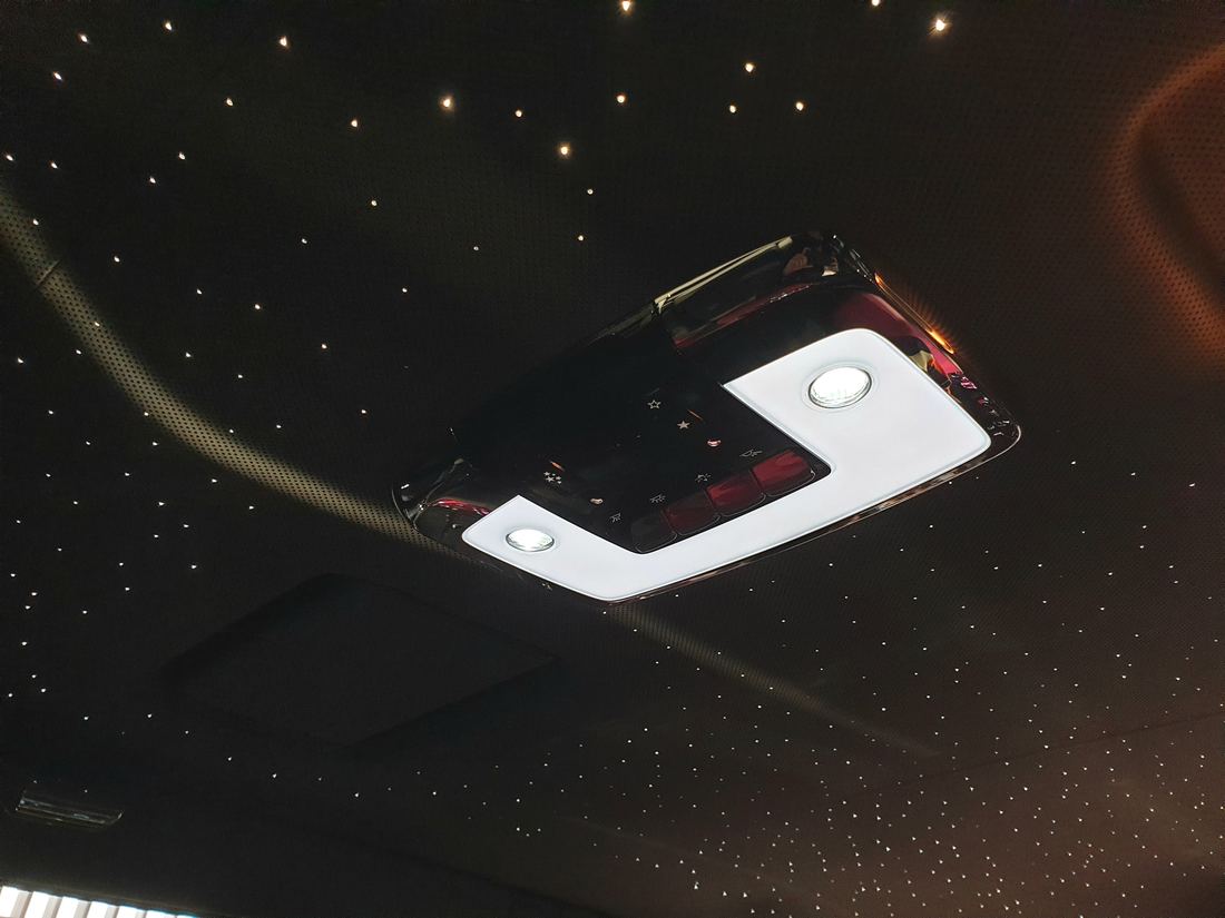 Tiny fibre-optic lights forming a starry sky in the roof lining of a Rolls-Royce Phantom